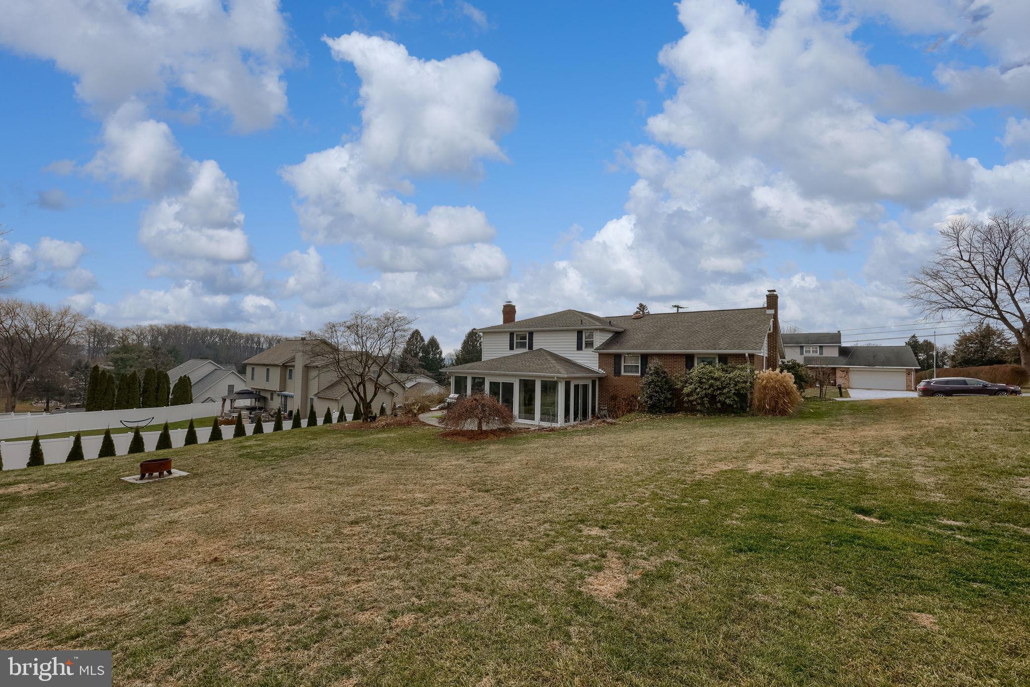 3161 Starlight Drive York, PA 17402 - Photo 10 of 51 Spacious yard with charming home backdrop.