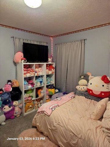 2639 Lilac Lane Sycamore, IL 60178 - Photo 13 of 16 a bedroom with a bed a window and dresser