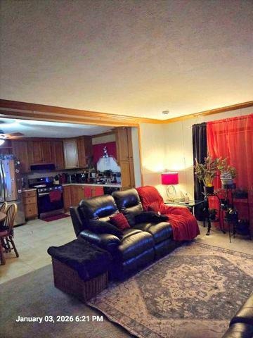 2639 Lilac Lane Sycamore, IL 60178 - Photo 5 of 16 a living room with furniture kitchen view and a flat screen tv