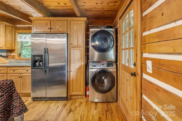 a kitchen with a refrigerator and a stove