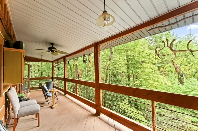 a view of a room with furniture and a window