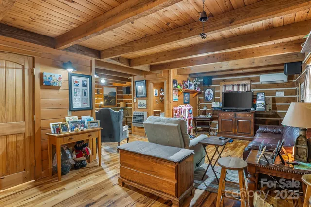 a living room with lots of furniture and a fireplace