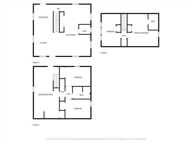 a backyard of a house with large trees and plants