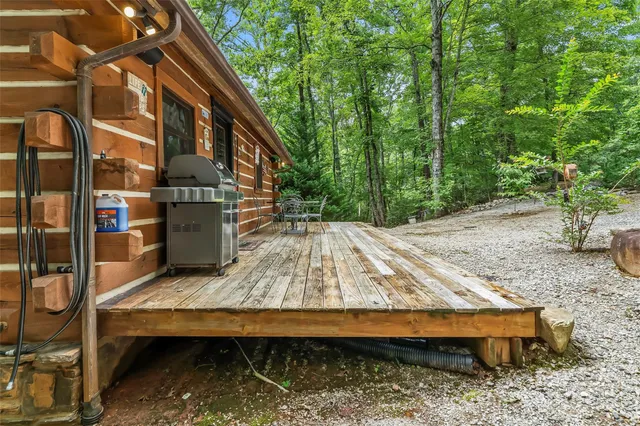 a wooden bench sitting in front of a house