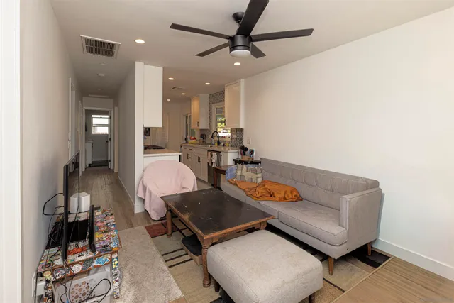 a living room with furniture and a rug