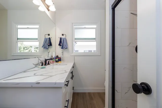 a bathroom with a sink and a window