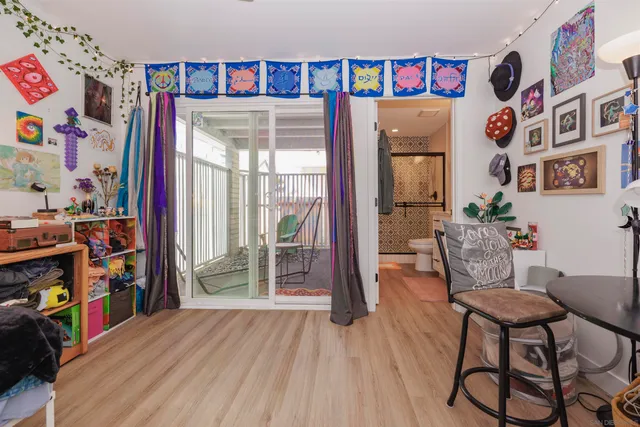 a living room with furniture and a book shelf