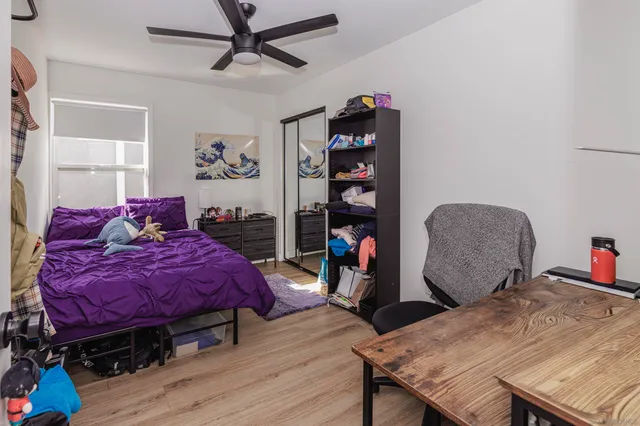 a bed room with a bed and a window