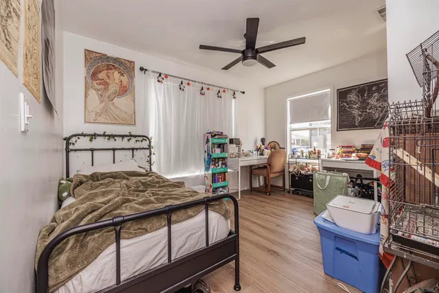 a bedroom with furniture and a window