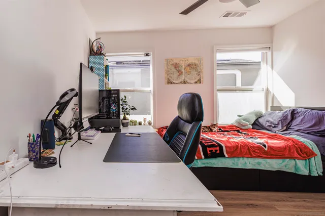 a bedroom with bed and a window