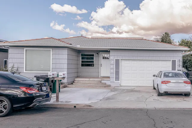 a view of a car parked in front of a house