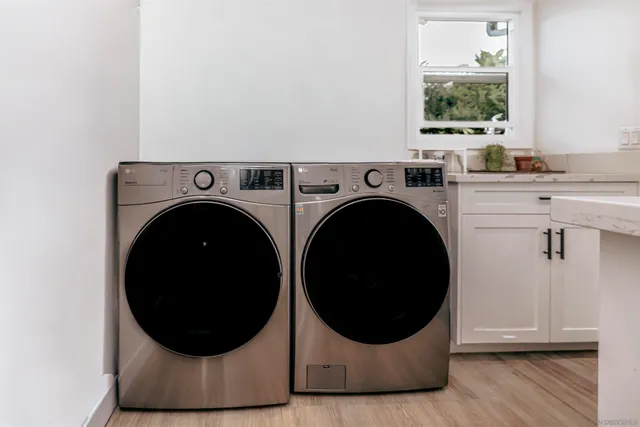 a view of a room with washer and dryer