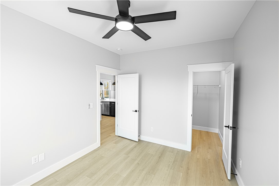 1296 Hebron Church Road Iva, SC 29655 - Photo 11 of 37 This bright room features a ceiling fan, a spacious closet, and durable flooring.