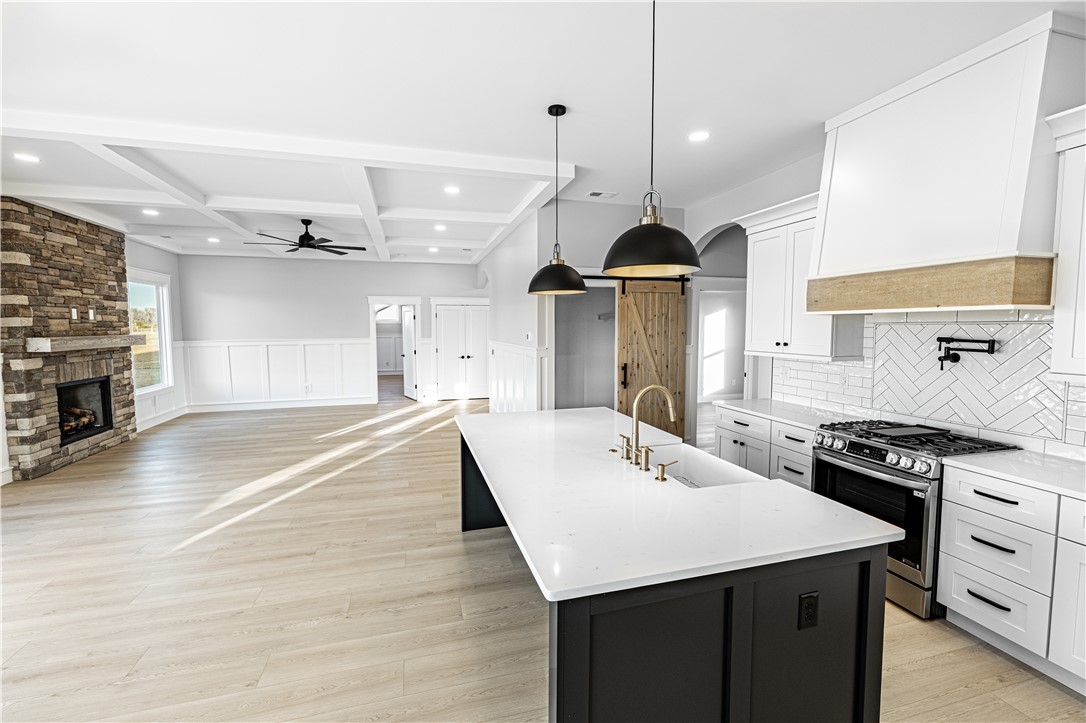 1296 Hebron Church Road Iva, SC 29655 - Photo 15 of 37 Bright and airy open-concept living, featuring a gourmet kitchen and inviting fireplace.