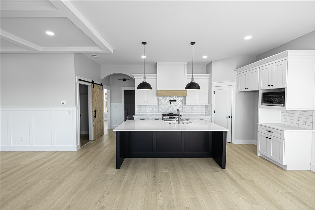 1296 Hebron Church Road Iva, SC 29655 - Photo 17 of 37 This bright kitchen features an expansive island and contemporary finishes, perfect for modern living.