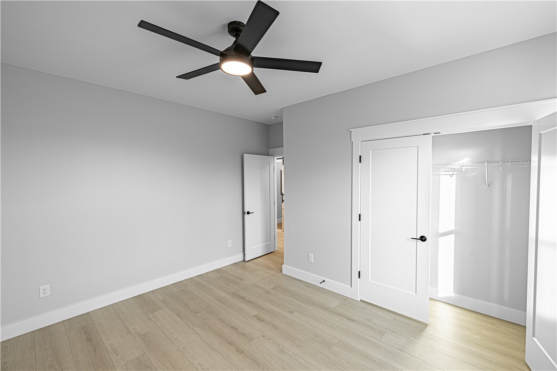 1296 Hebron Church Road Iva, SC 29655 - Photo 18 of 37 This spacious bedroom offers abundant natural light and modern finishes, perfect for comfortable living.