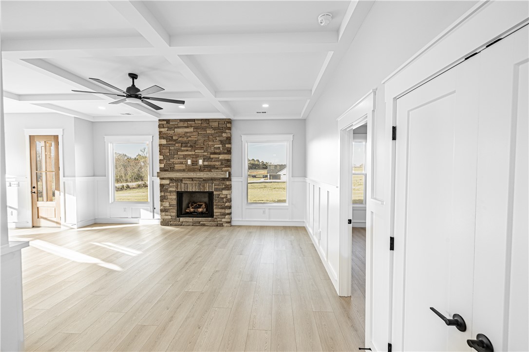 1296 Hebron Church Road Iva, SC 29655 - Photo 20 of 37 This airy living space features beautiful flooring and a charming fireplace, perfect for gatherings.