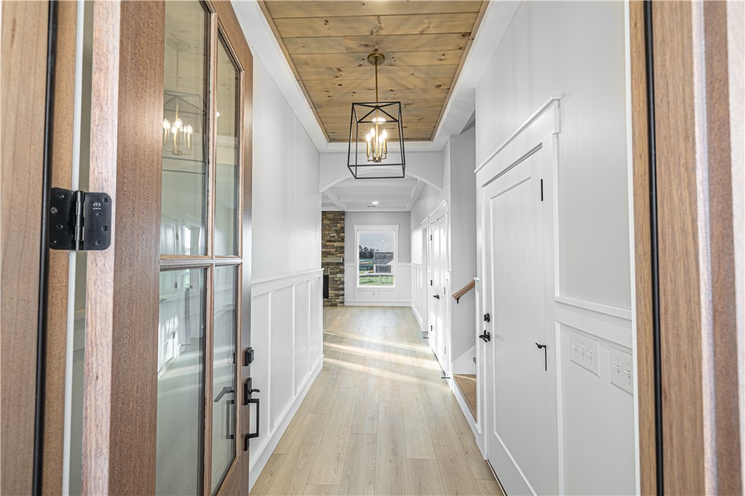 1296 Hebron Church Road Iva, SC 29655 - Photo 22 of 37 This spacious foyer welcomes you with light wood flooring and wainscoting.