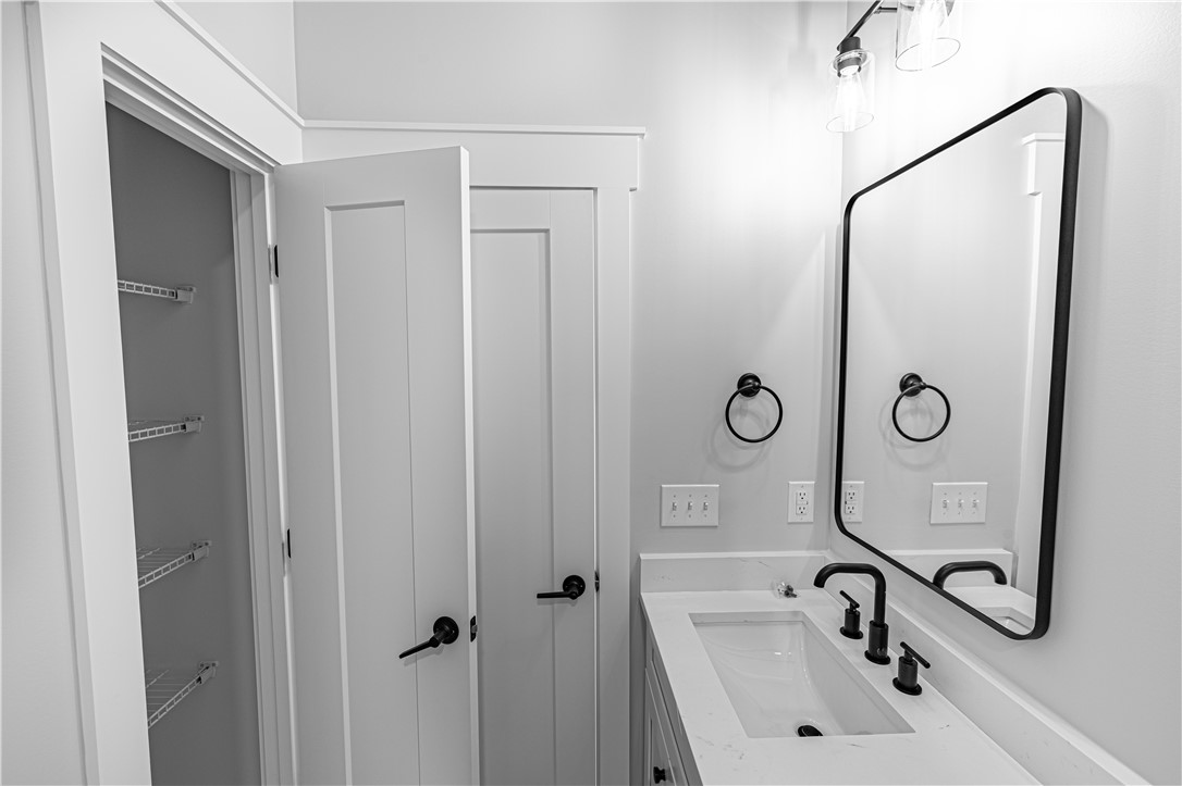 1296 Hebron Church Road Iva, SC 29655 - Photo 28 of 37 This modern bathroom features a stylish vanity and convenient storage.