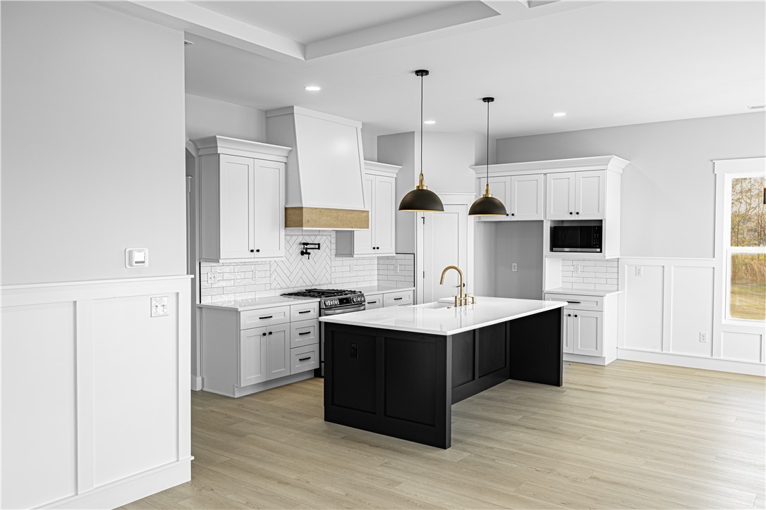 1296 Hebron Church Road Iva, SC 29655 - Photo 30 of 37 This kitchen showcases a perfect blend of style and functionality, ideal for culinary endeavors and gatherings.