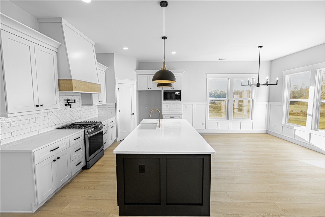 1296 Hebron Church Road Iva, SC 29655 - Photo 32 of 37 An inviting open-concept kitchen boasts a large island and ample natural light, perfect for gatherings.