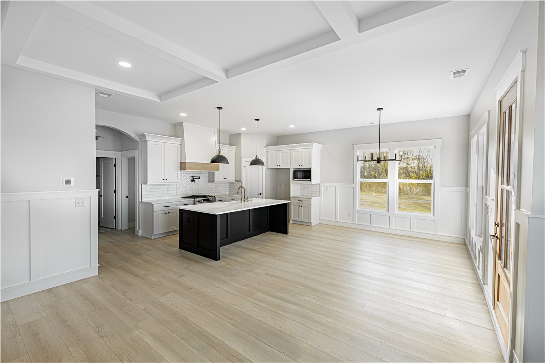 1296 Hebron Church Road Iva, SC 29655 - Photo 33 of 37 This expansive kitchen and dining area features abundant natural light and modern finishes.