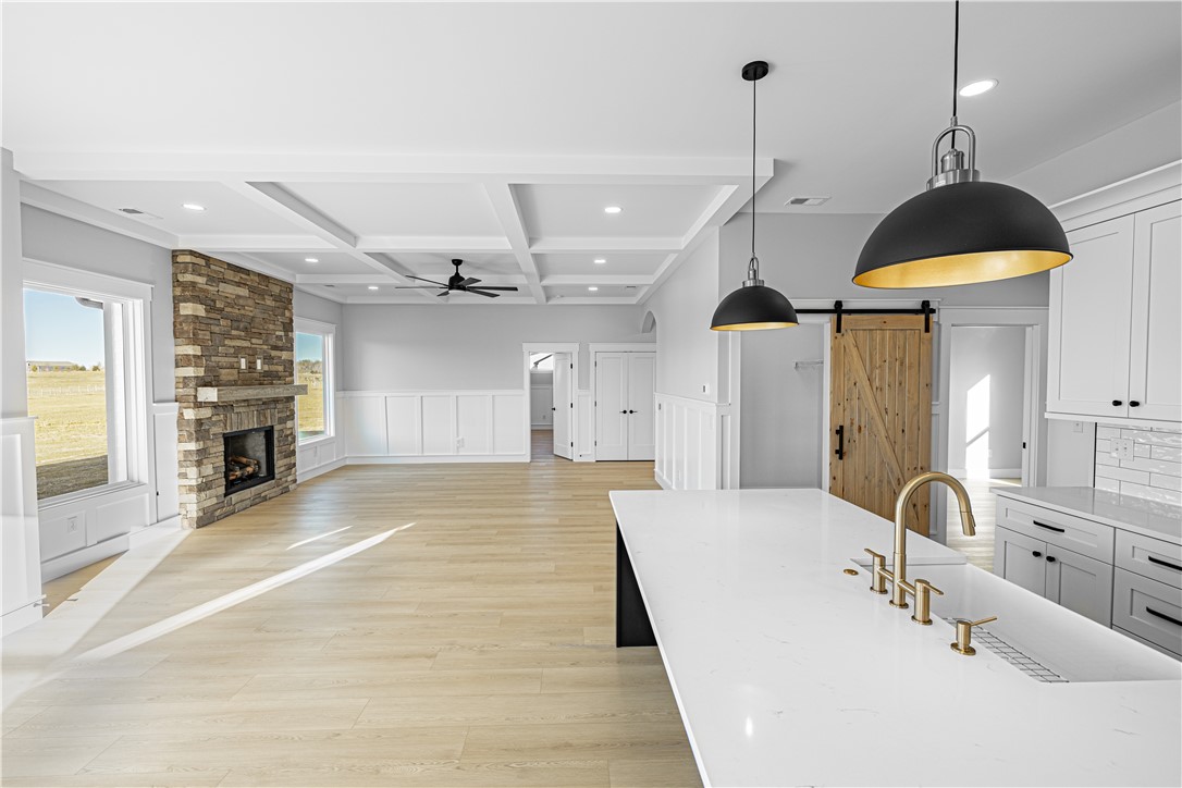 1296 Hebron Church Road Iva, SC 29655 - Photo 4 of 37 Bright and inviting living area with a stone fireplace and modern kitchen.