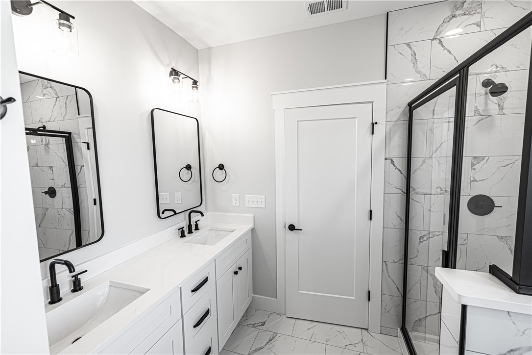 1296 Hebron Church Road Iva, SC 29655 - Photo 6 of 37 This modern bathroom features a sleek design with clean lines and elegant finishes.
