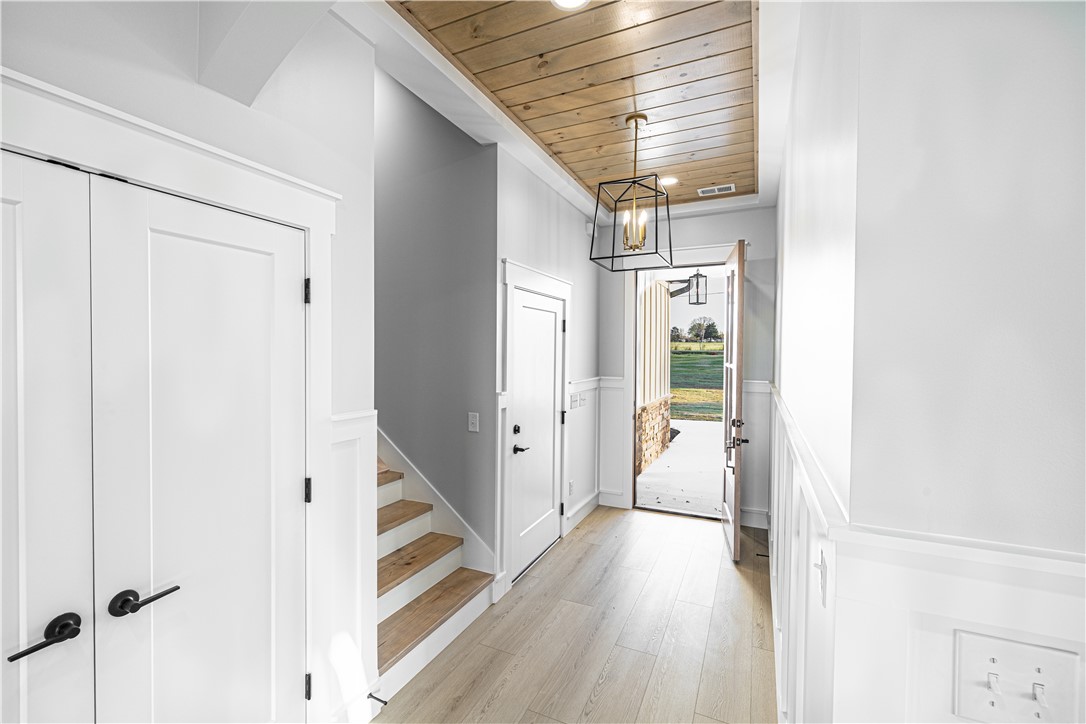 1296 Hebron Church Road Iva, SC 29655 - Photo 10 of 37 This inviting entrance features a grand front door, natural wood accents, and a stylish light fixture.