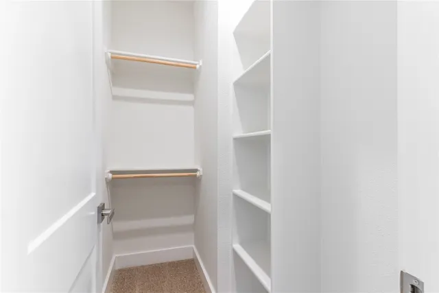 a view of a hallway with stairs