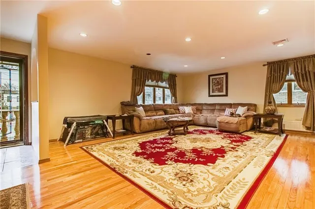a living room with furniture and a rug