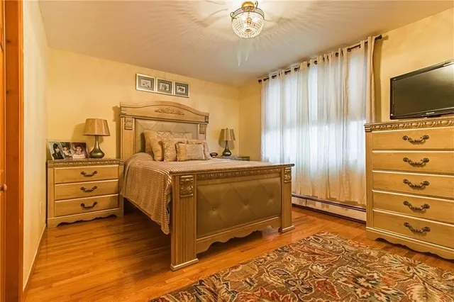 a bed room with a bed and a television