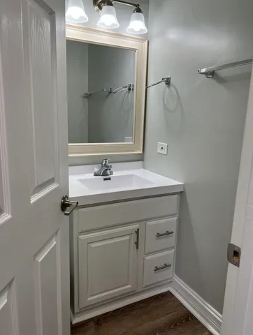 a kitchen with wooden cabinets and sink