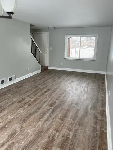 a view of entryway with wooden floor
