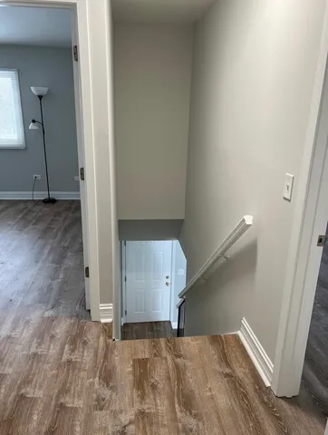 a view of an empty room with a fireplace