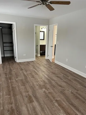 a bathroom with double vanity sinks and a mirror