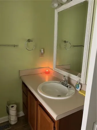 a bathroom with a sink and a mirror