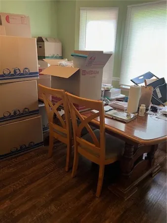 a view of a workspace with furniture