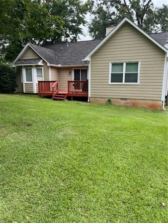 a front view of a house with a yard and porch