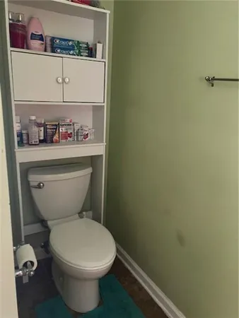 a bathroom with a toilet and a sink