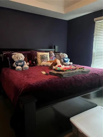 a bedroom with two beds and a night stand