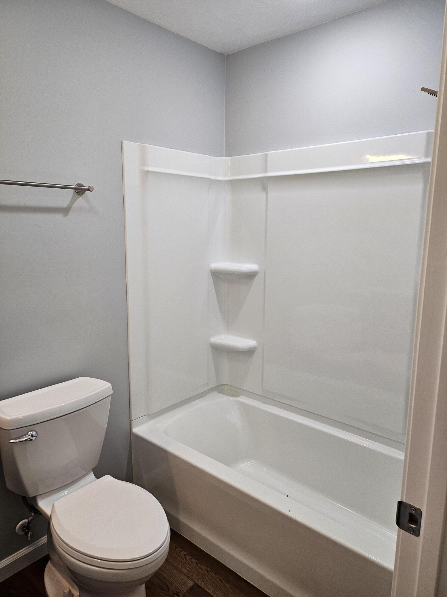 4443 Keefer Road Roanoke, VA 24018 - Photo 13 of 26 a white toilet and tub sitting next to a bathroom sink