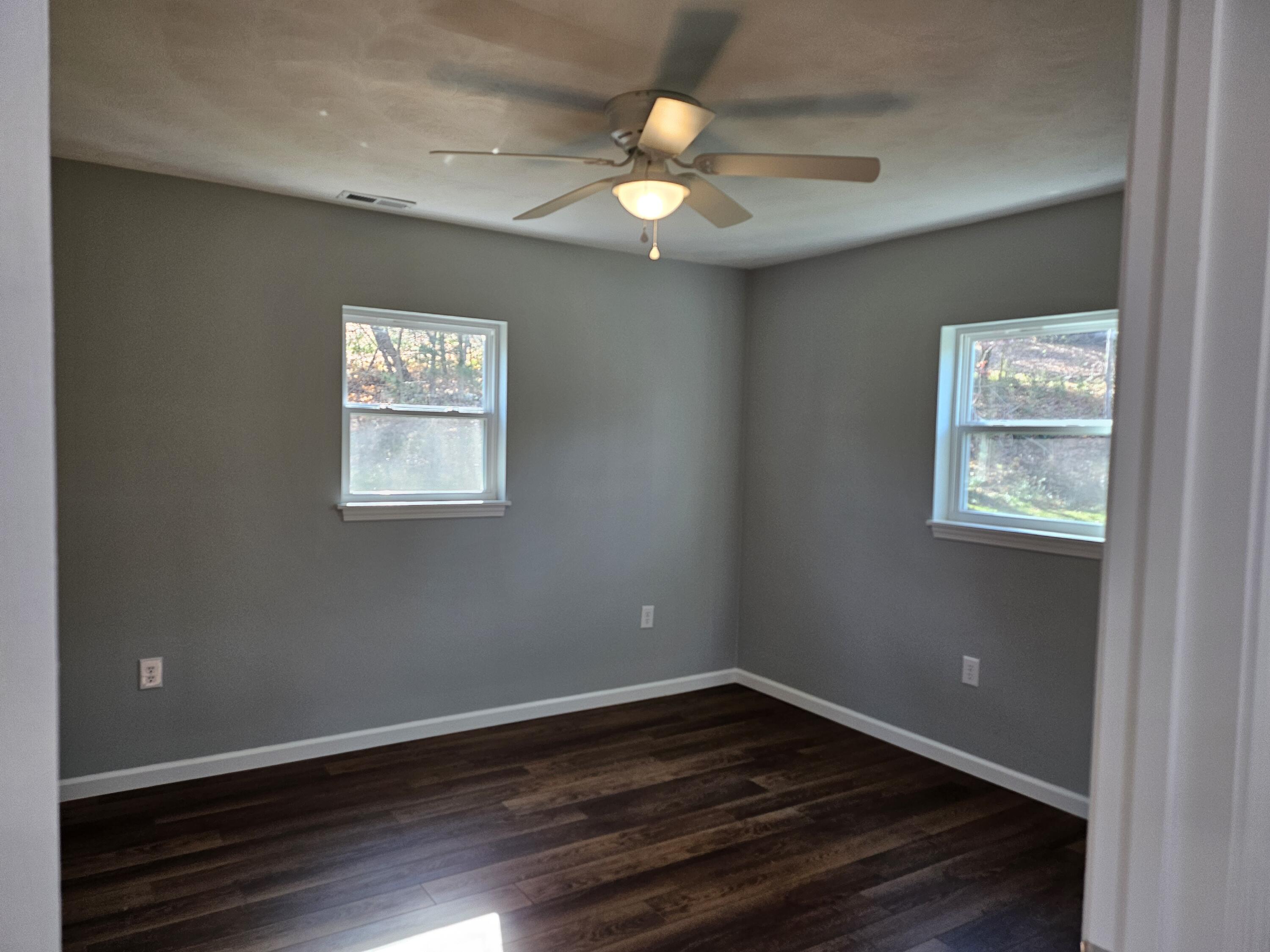 4443 Keefer Road Roanoke, VA 24018 - Photo 16 of 26 an empty room with wooden floor and windows