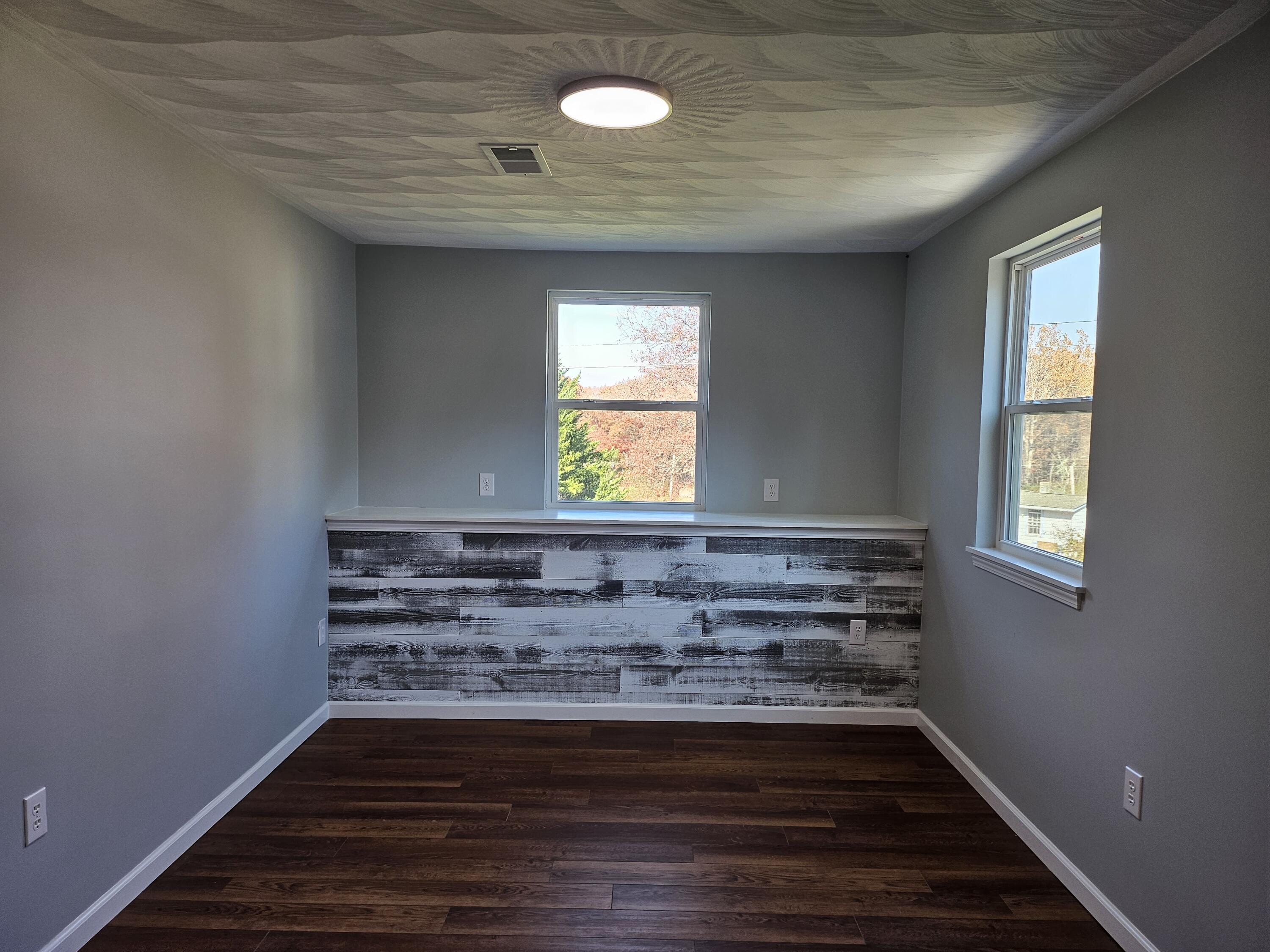 4443 Keefer Road Roanoke, VA 24018 - Photo 22 of 26 a view of room with window and wooden floor