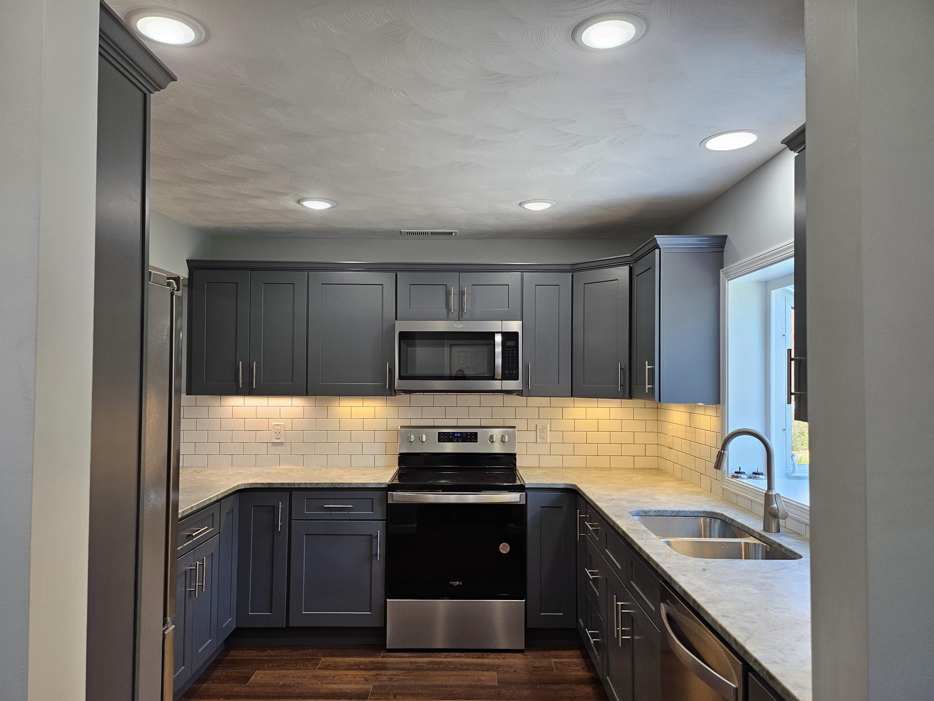 4443 Keefer Road Roanoke, VA 24018 - Photo 6 of 26 a kitchen with granite countertop stainless steel appliances and sink