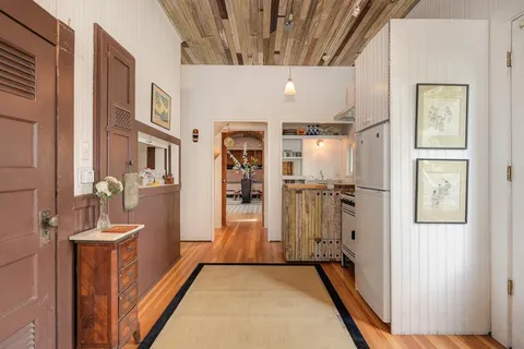 a view of a hallway with windows