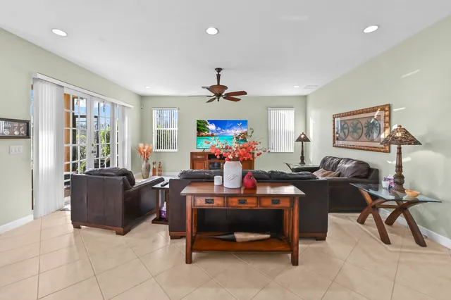 a view of a room with furniture and windows