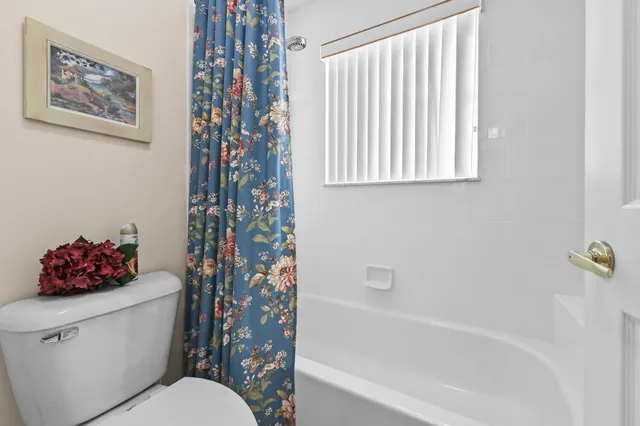 an aerial view of a house with a swimming pool outdoor seating and yard