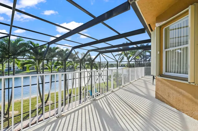 an aerial view of a house with yard swimming pool and outdoor seating