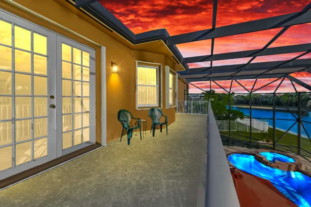 an aerial view of a residential houses with outdoor space